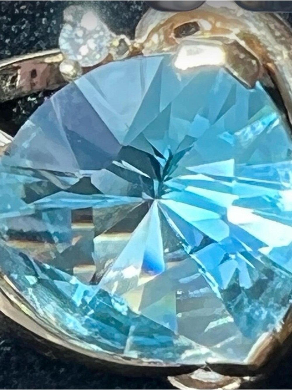 Vintage Trillion Cut Light
Blue Topaz Ring with Diamond Accent Set in 14Kt Gold